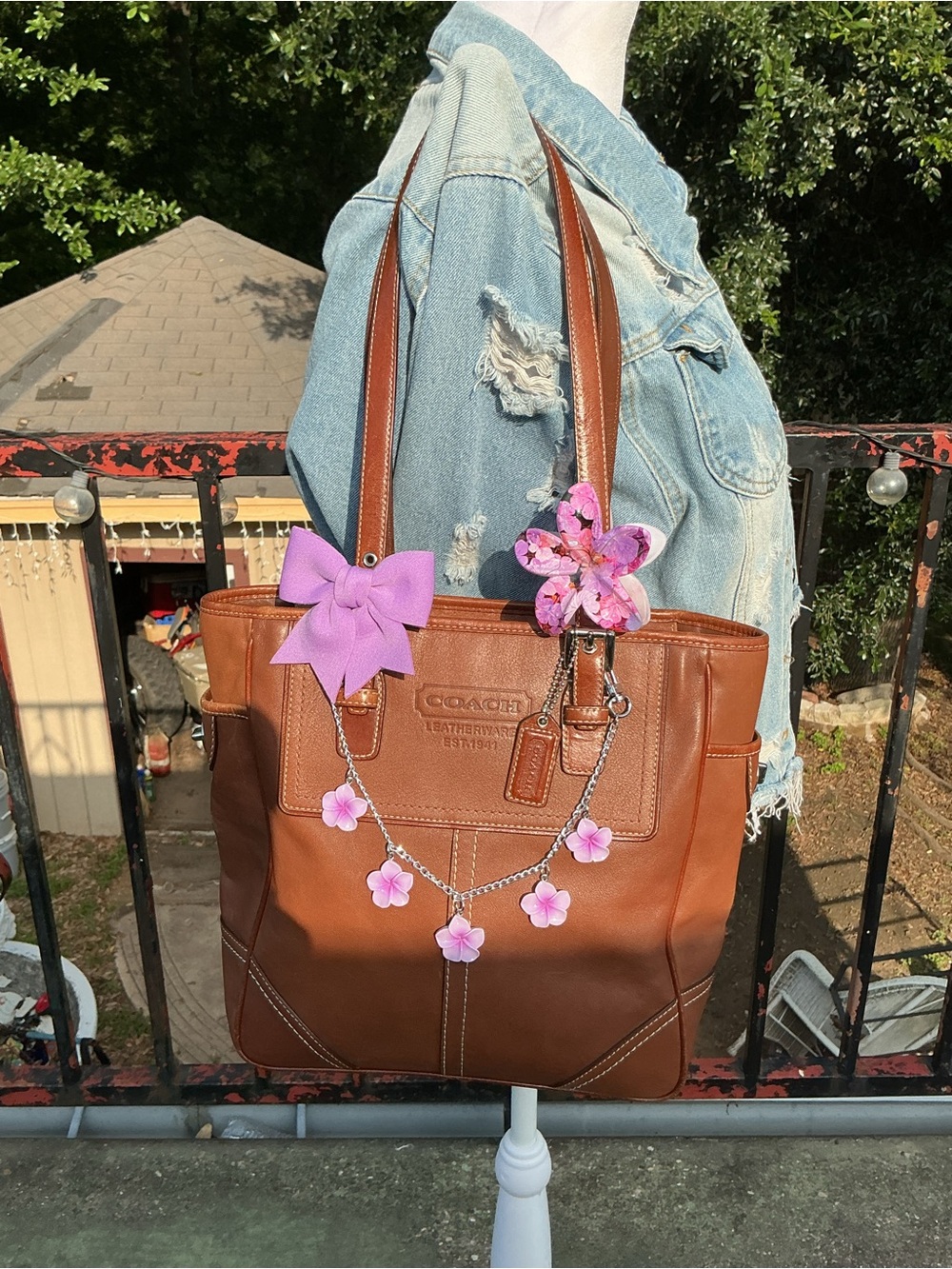 Coach Brown Leather Tote with Pink Floral Charms and Bow